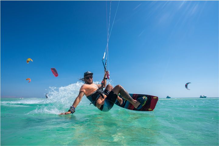 Kite-surfing in clear blue waters while being carried by the wind, could it get any better? EgyptNow ExperienceEgypt Egypt Египет Ägypten Egitto مصر 51921